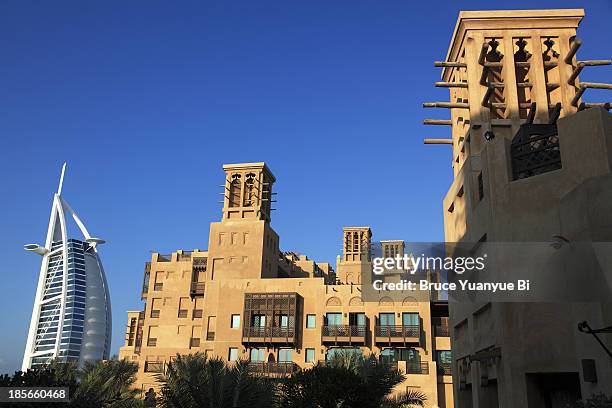 burj al arab hotel with madinat jumeirah in front - al qasr stock pictures, royalty-free photos & images