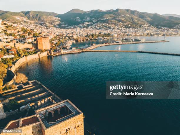 old shipyard and walls of alanya fortress, neat the sea antalya turkey - alanya castle stock pictures, royalty-free photos & images