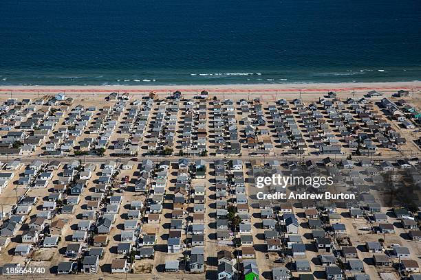 Neighborhood sits with abandoned lots and reconstructed homes after being partially destroyed by Superstorm Sandy in October 2012, on October 21,...