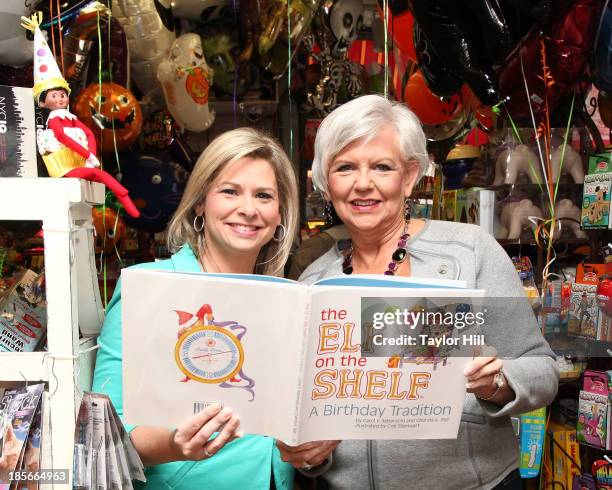 The Elf on the Shelf: A Birthday Tradition" authors Chanda Bell and Carol Aebersold pose for a private photo shoot at Balloon Saloon on October 23,...