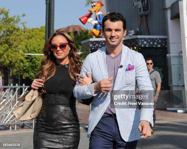 Leah Remini and Tony Dovolani visit "Extra" at Universal Studios Hollywood on October 23, 2013 in Universal City, California.