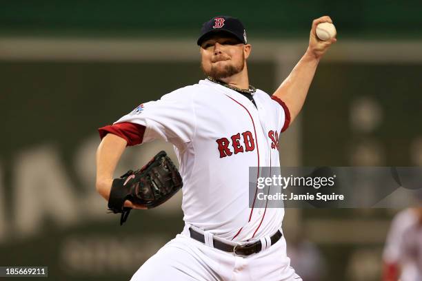 Jon Lester of the Boston Red Sox pitches against the St. Louis Cardinals in the first inning of Game One of the 2013 World Series at Fenway Park on...