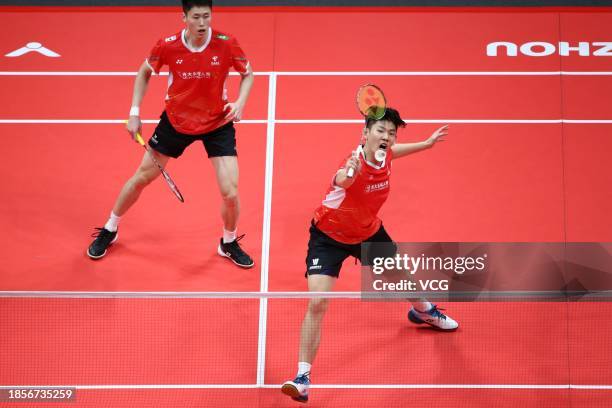 Liu Yuchen and Ou Xuanyi of China compete in the Men's Doubles Round Robin match against Takuro Hoki and Yugo Kobayashi of Japan on day 3 of the BWF...