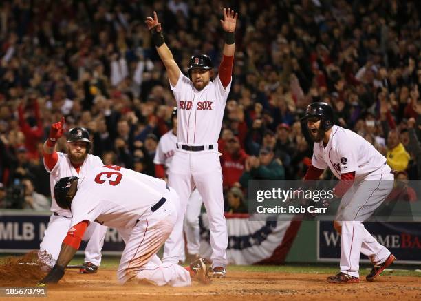 David Ortiz of the Boston Red Sox scores after a hit by Mike Napoli in the first inning against the St. Louis Cardinals during Game One of the 2013...