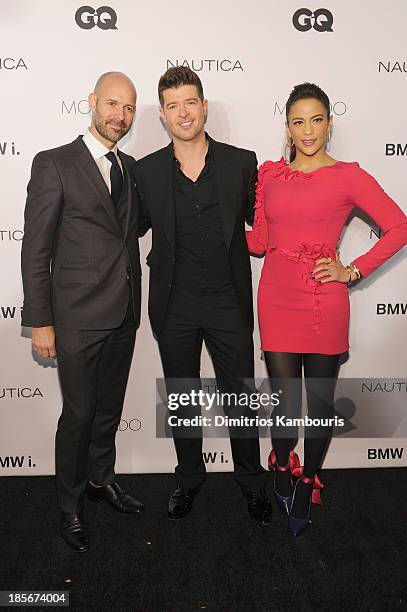 Vice President & Publisher at GQ, Chris Mitchell, singer Robin Thicke and actress Paula Patton walk the red carpet at the 2013 GQ Gentlemen's Ball...