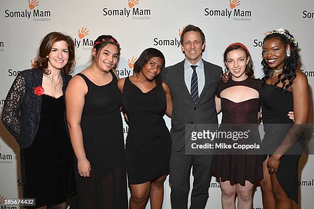 Actor Seth Meyers poses with the Girls Be Heard artists and Jessica Greer Morris, MPH, Executive Director & Co-Founder of Girls Be Heard at the...