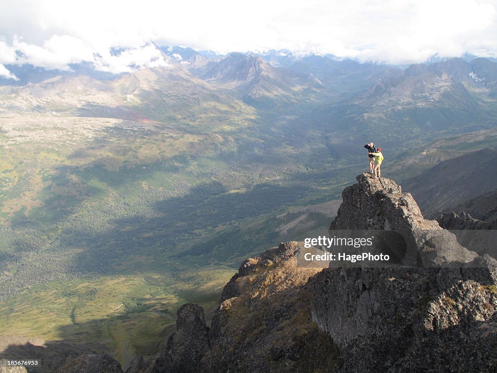 Backpackers hike in Chugach State Park near Anchorage, Alaska.