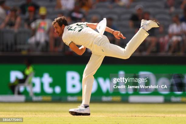 Mitchell Starc of Australia follows through after his bowling during day two of the Men's First Test match between Australia and Pakistan at Optus...