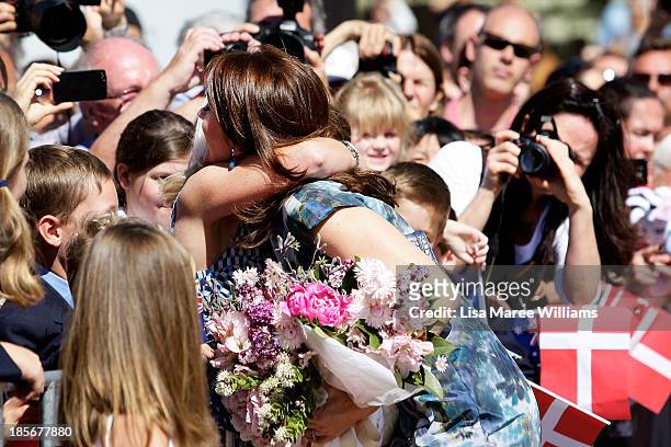 Crown Princess Mary of Denmark greets members of the public at the Opera House forecourt on October 24, 2013 in Sydney, Australia. Prince Frederik...