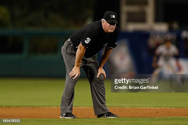 Umpire Tim Welke stands on the field during a game between the San Francisco Giants and the Philadelphia Phillies at Citizens Bank Park on July 31,...