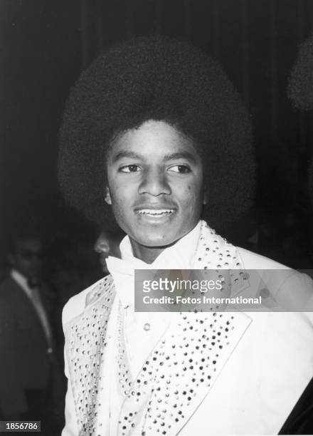 American singer Michael Jackson poses at the Grammy Awards wearing a white tuxedo with sequined lapels at the Hollywood Palladium, Hollywood,...