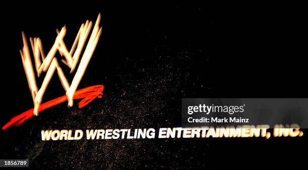 The World Wrestling Entertainment logo hangs on a wall at a media conference announcing the all-star lineup of WWE WrestleMania XIX at ESPN Zone in...