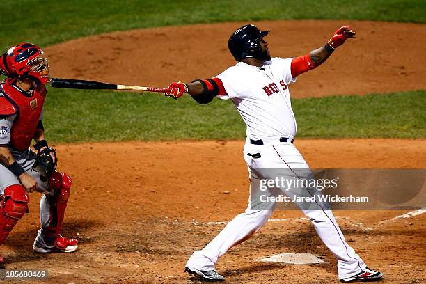 David Ortiz of the Boston Red Sox hits a home run in the seventh inning against the St. Louis Cardinals during Game One of the 2013 World Series at...