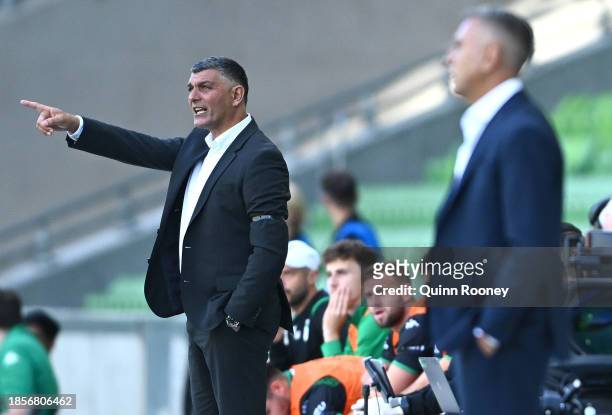 John Aloisi the coach of Western United and Ross Aloisi the coach of Brisbane Roar give instructions from the sidelines during the A-League Men round...
