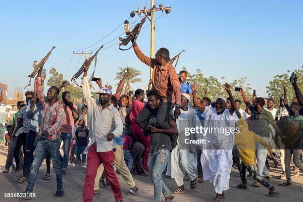 People rally in support of Sudan's army in Wad Madani on December 17 amid the ongoing war against the paramilitary Rapid Support Forces ....