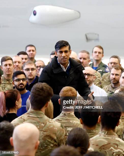 Britain's Prime Minister Rishi Sunak addresses RAF military personnel in the Poseidon hanger during his visit to Royal Air Force base Lossiemouth in...