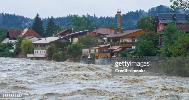 town being flooded by river overflowing - overflowing river stock pictures, royalty-free photos & images