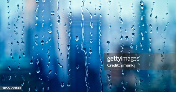 close-up of raindrops on window - shower stock pictures, royalty-free photos & images