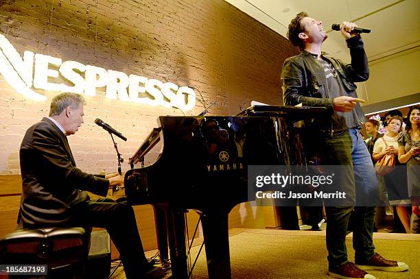 Composer David Foster and singer Michael Johns perform onstage to celebrate the opening of the new Nespresso Beverly Hills Flagship boutique on...