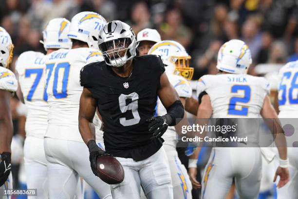 Defensive end Tyree Wilson of the Las Vegas Raiders celebrates recovering a fumble against the Los Angeles Chargers in the first quarter at Allegiant...