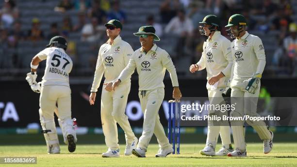 David Warner of Australia celebrates after catching Abdullah Shafique during day two of the Men's First Test match between Australia and Pakistan at...