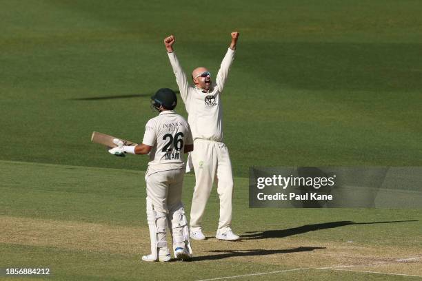 Nathan Lyon of Australia celebrates the wicket of Abdullah Shafique of Pakistan during day two of the Men's First Test match between Australia and...