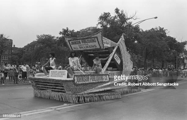 View of Miss Negro Digest and others as they ride the Johnson Publishing float, during the Bud Billiken Day parade, Chicago, Illinois, mid to late...