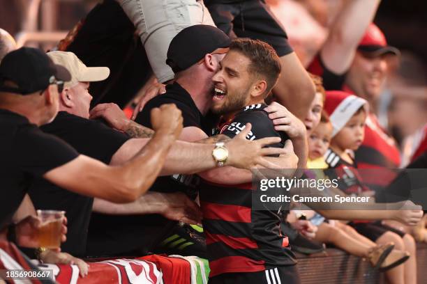 Dylan Pierias of the Wanderers celebrates kicking a goal with fans during the A-League Men round eight match between Western Sydney Wanderers and...