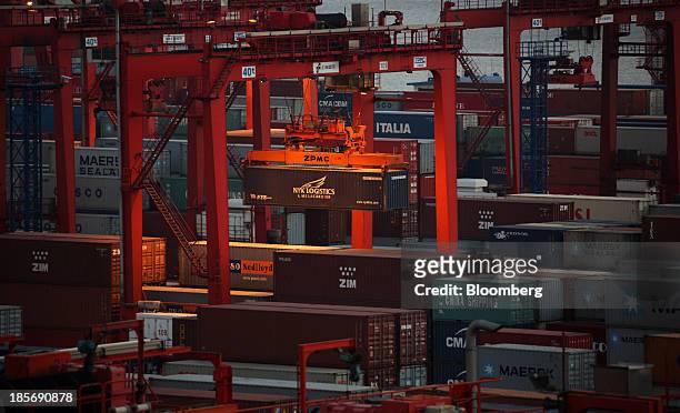 Nippon Yusen K.K. Shipping container is moved with a crane at the Yangshan Deep Water Port, part of China Pilot Free Trade Zone's Yangshan free trade...