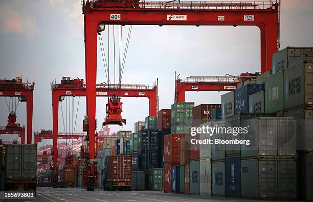 Shipping containers are stacked at the Yangshan Deep Water Port, part of China Pilot Free Trade Zone's Yangshan free trade port area, in Shanghai,...