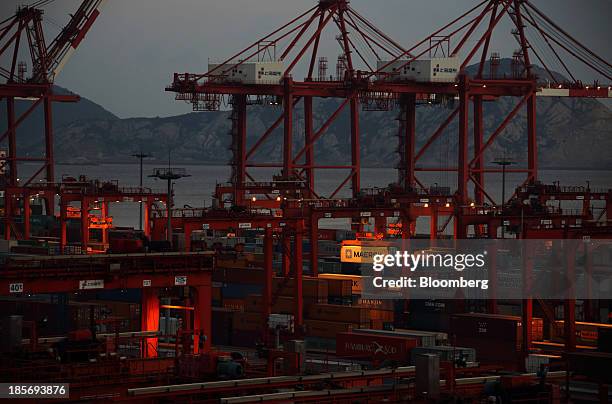 An A.P. Moeller-Maersk A/S shipping container is moved with a crane at the Yangshan Deep Water Port, part of China Pilot Free Trade Zone's Yangshan...