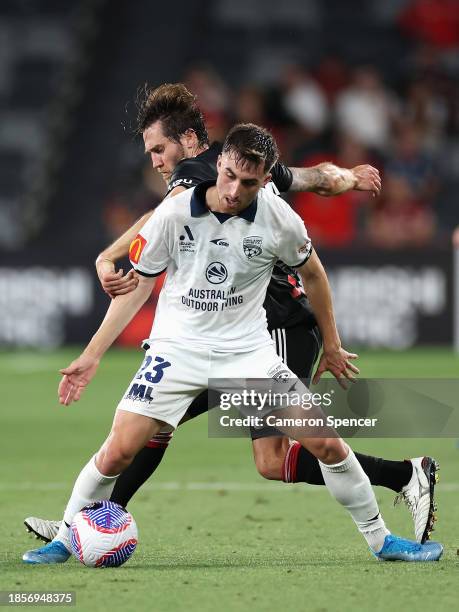 Luke Duzel of United and Joshua Brillante of the Wanderers contest the ball during the A-League Men round eight match between Western Sydney...