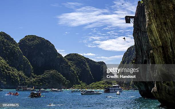 In this handout image provided by Red Bull, Gary Hunt of the UK dives from the 27 metre platform at Maya Bay in the Andaman Sea during the final stop...
