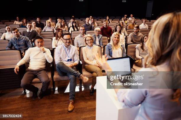 crowd of happy people attending a seminar in convention center. - rate announcement news conference stockfoto's en -beelden