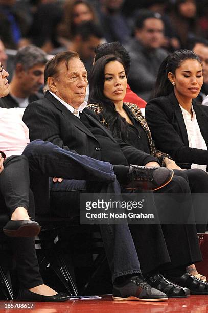 Los Angeles Clippers owner Donald Sterling and V. Stiviano look on from their seats during a game against the Utah Jazz at Staples Center on October...
