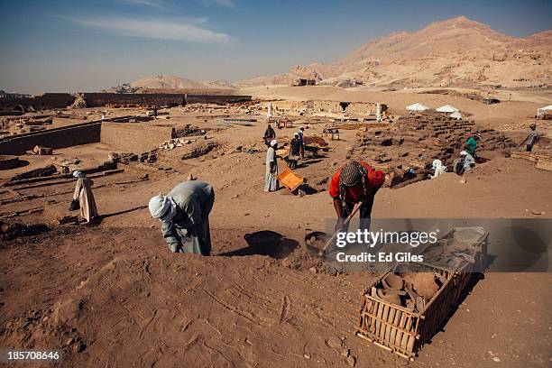 Egyptian men work at an archaeological site near the Valley of the Kings on October 24, 2013 in Luxor, Egypt. The site, run in partnership by the...