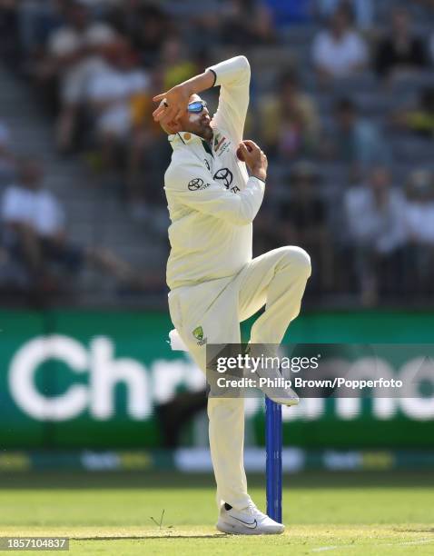 Nathan Lyon of Australia bowls during day two of the Men's First Test match between Australia and Pakistan at Optus Stadium on December 15, 2023 in...