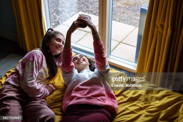 taking a selfie in the bedroom - spring arrival stock pictures, royalty-free photos & images