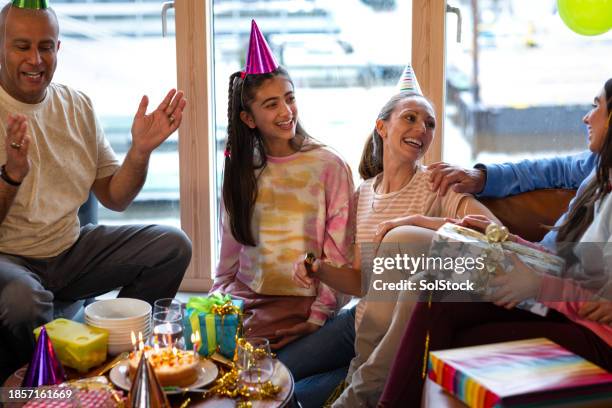 a family birthday to treasure - birthday party stock pictures, royalty-free photos & images