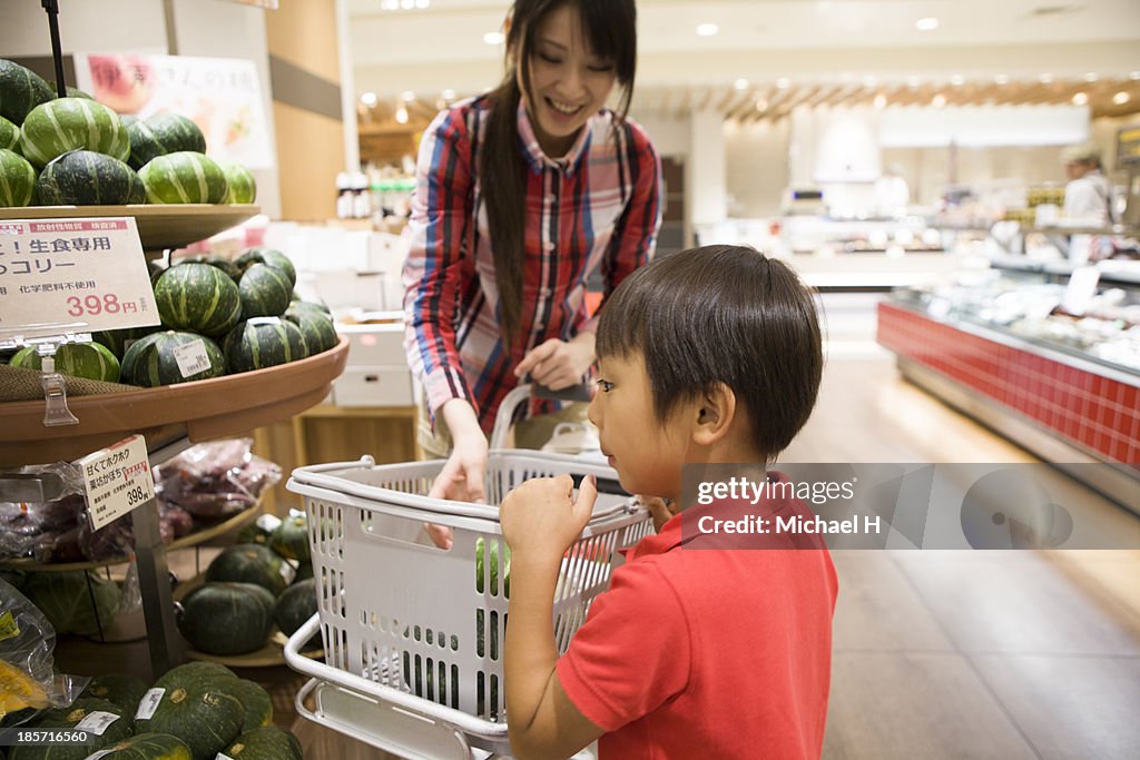 Young mother and child at green-grocer