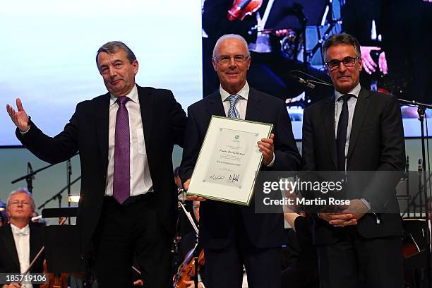 Franz Beckenbauer is presented with the DFB honor membership by DFB president Wolfgang Niersbach and DFB general secretary Helmut Sandrock on October...