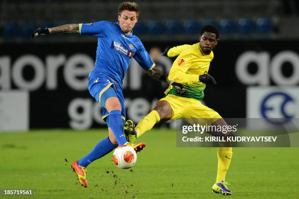 Tromso IL's forward Steffen Nystrom vies with Anji Makhachkala's defender Ayodele Adeleye during their UEFA Europa League Group K football match in...