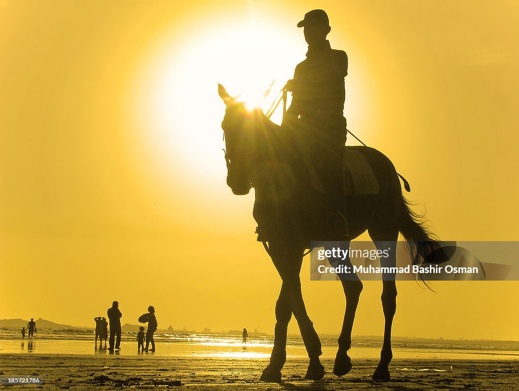 A POLO PLAYER AND THE SUNSET