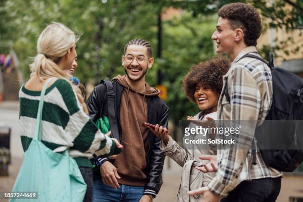 students chatting in the city before uni - close medium shot stock pictures, royalty-free photos & images