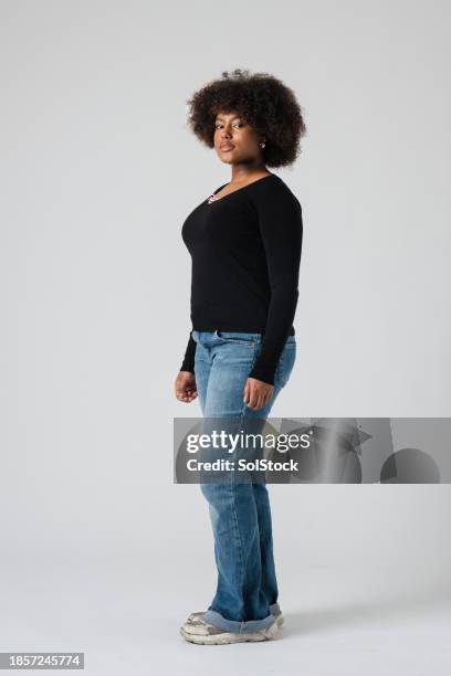 cool attitude in the studio - black jeans stock pictures, royalty-free photos & images