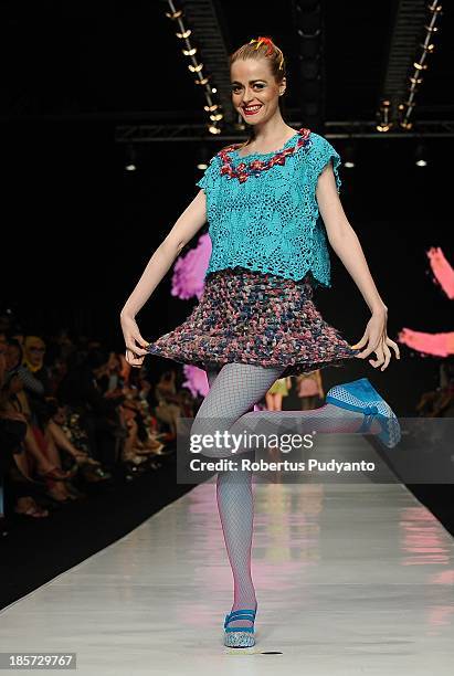 Model showcases designs by Lenni Agustin on the runway at the Body Shop show during Jakarta Fashion Week 2014 at Senayan City on October 24, 2013 in...