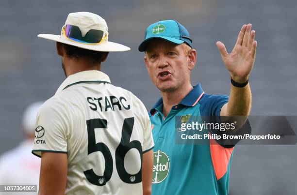 Andrew McDonald and Mitchell Starc of Australia talk after day two of the Men's First Test match between Australia and Pakistan at Optus Stadium on...