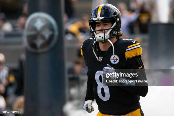 Pittsburgh Steelers quarterback Kenny Pickett runs onto the field during the regular season NFL football game between the Arizona Cardinals and the...