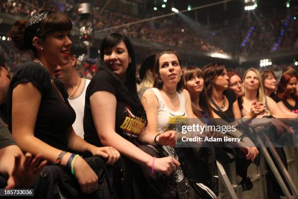 Fans attend a The BossHoss concert in Max Schmeling Halle on October 24, 2013 in Berlin, Germany.