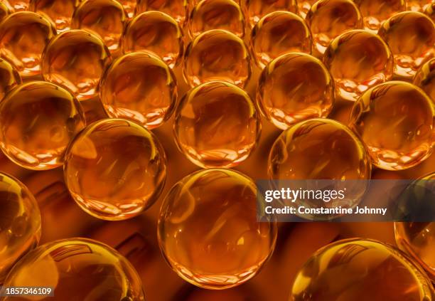 array of golden reflective glass sphere - glass molecule stock pictures, royalty-free photos & images